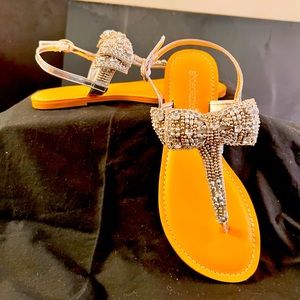 Brand new never worn silver jewel sandals with a bow size 6
